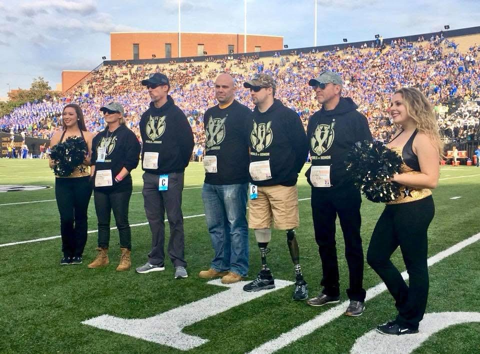 Memories of Honor participants recognized on the field at a college football game