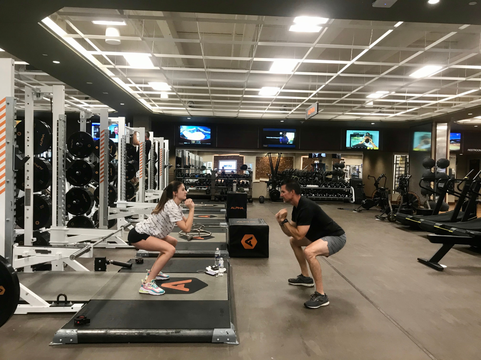 Jim Cotta coaching athletes in a strength-training facility during his career