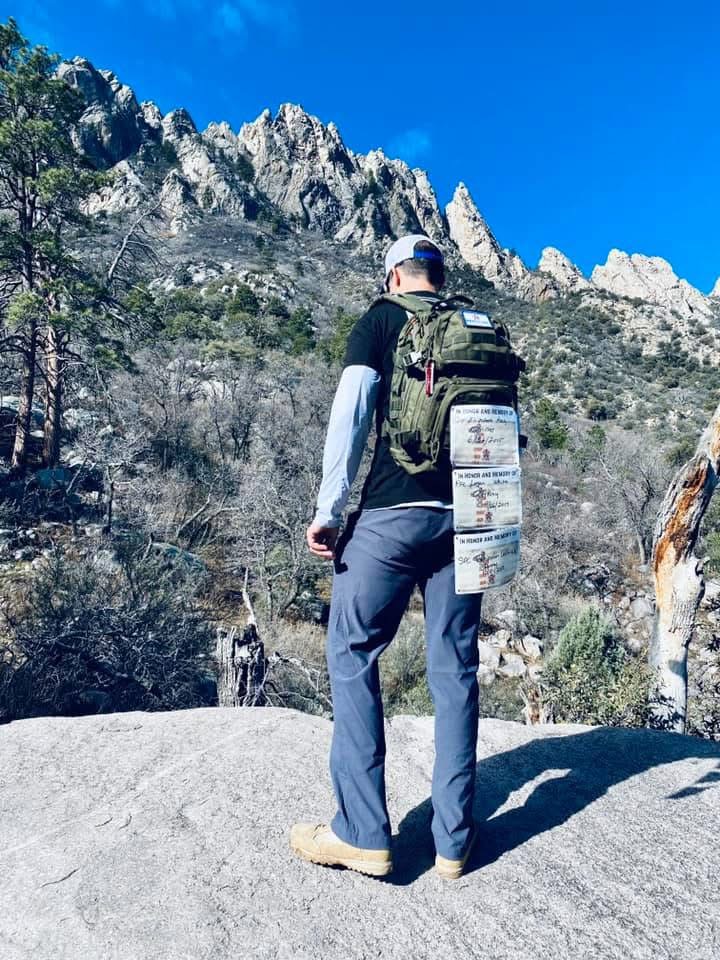 A Memories of Honor ruck carrying tribute cards for fallen service members in the mountains